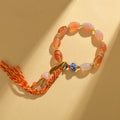 Vintage ethnic style jinsi jade agate Tibetan bracelet with floral and geometric shapes.