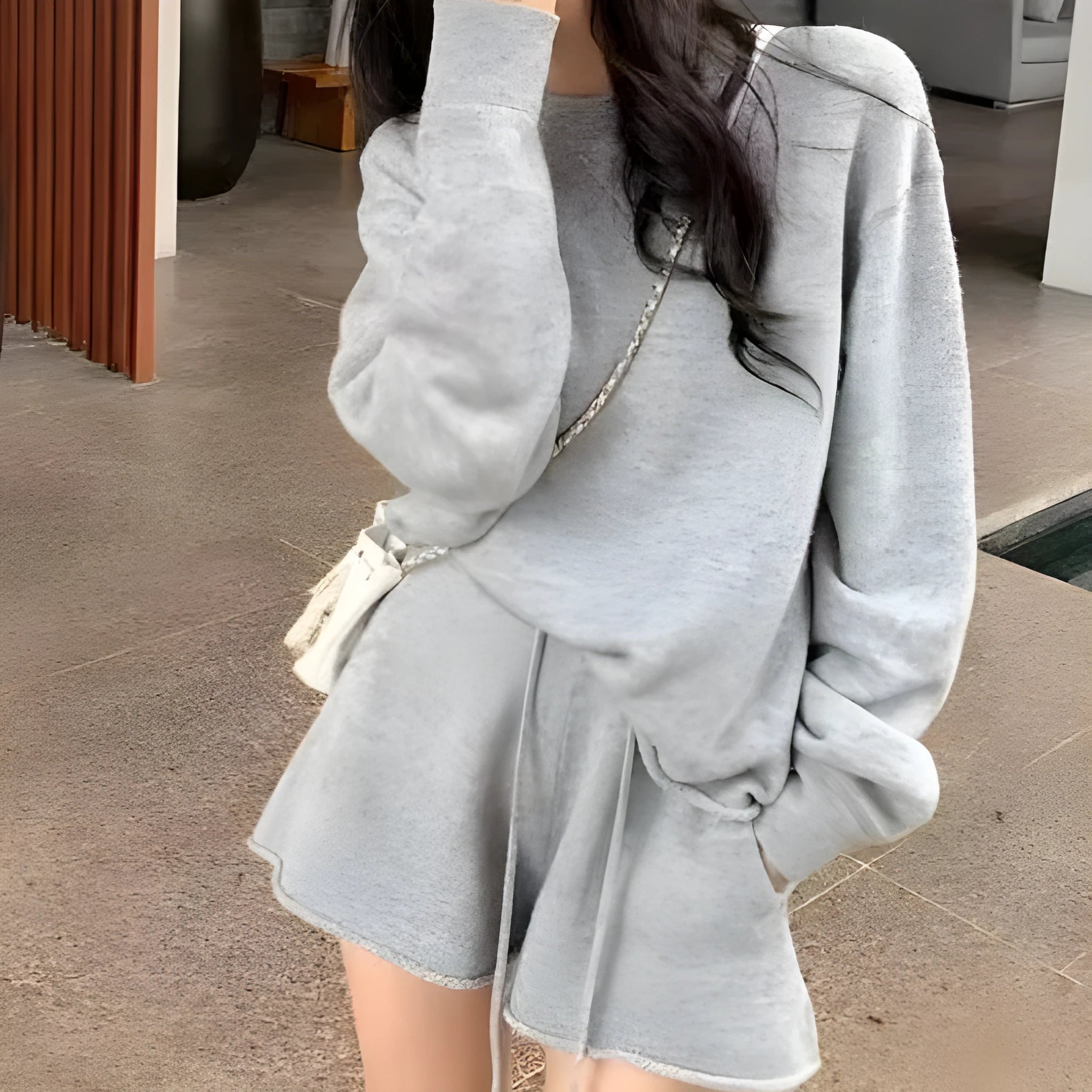 Women's loose-fit long sleeve sweater and knitted wide-leg shorts two-piece set in oatmeal colour.