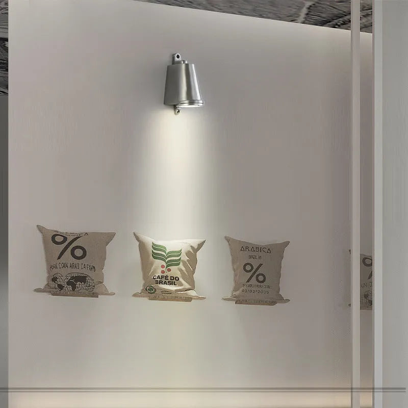 Industrial-style cast aluminum horseshoe wall lamp for outdoor use in sand black finish.