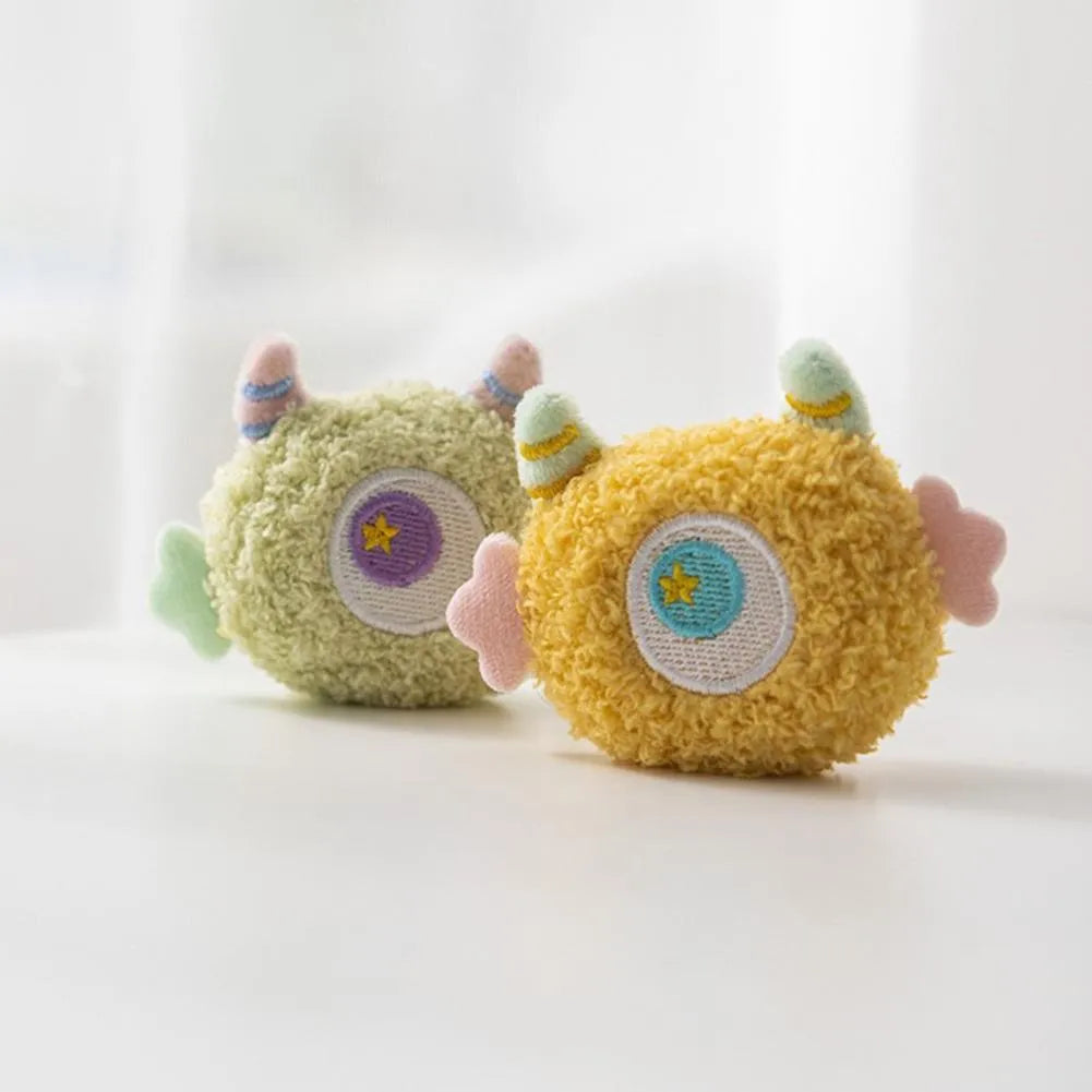 Cartoon-shaped plush dog chew toy with large eyes and squeaker in assorted colours