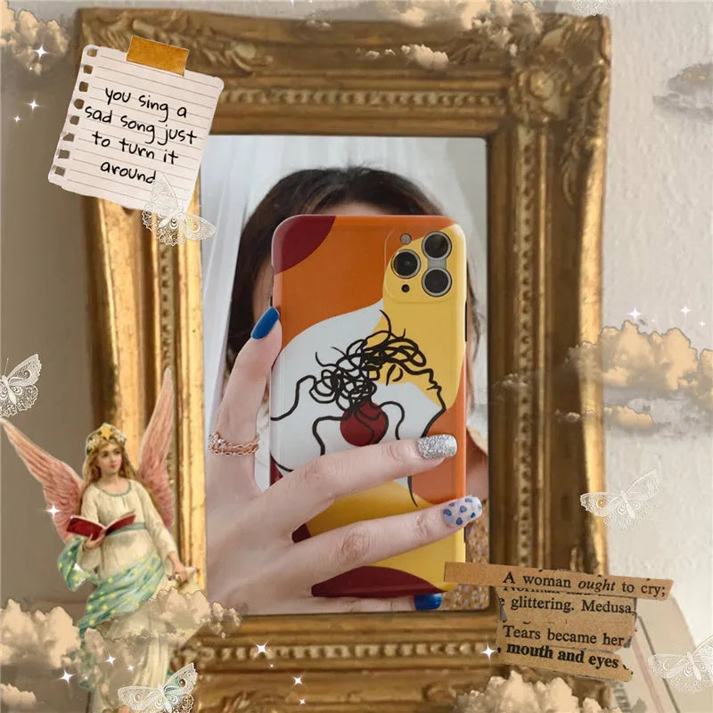 Orange yellow iPhone case with a colourful line painting cartoon design on a soft, textured surface.