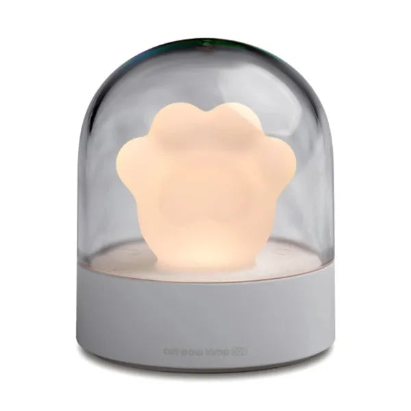 Grey cat paw USB charging music box night light with adjustable brightness on wooden desk