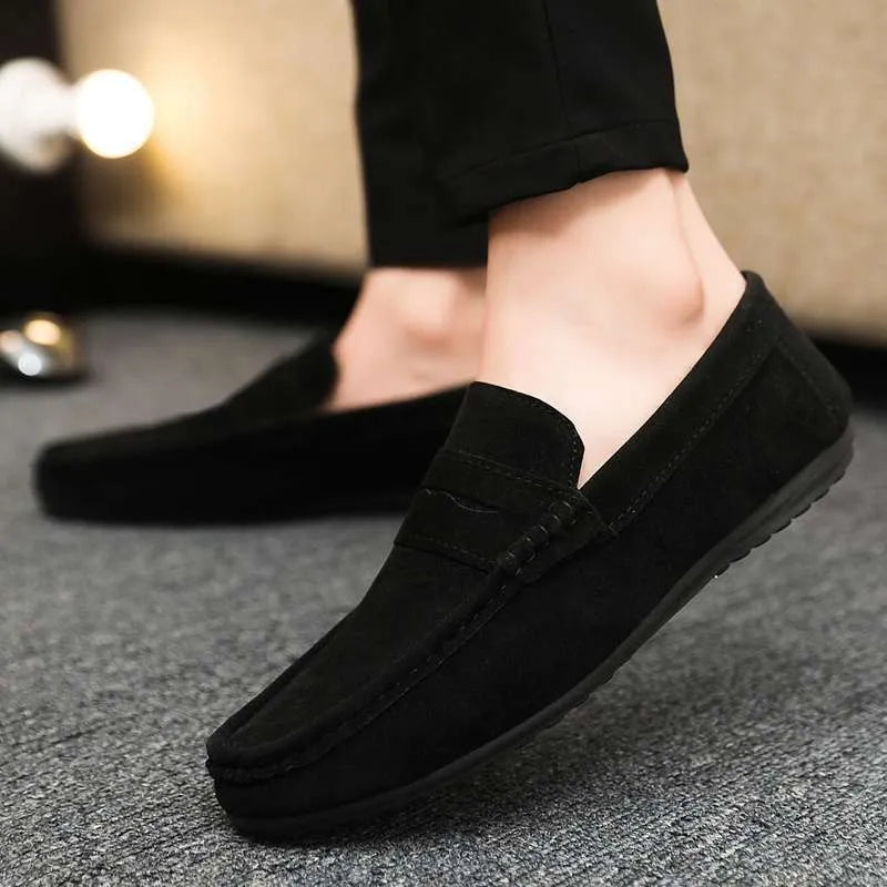 Men's Gommino Korean fashion slip-on shoes in black colour showing round toe and textured upper