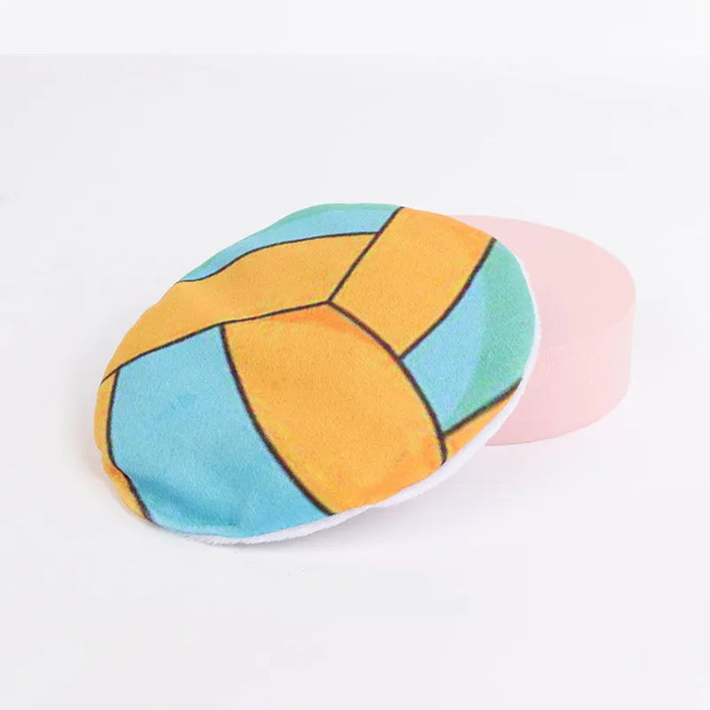 Soft plush cat toy with sports ball pattern, functioning as a flying disc with internal catnip and crinkle sound