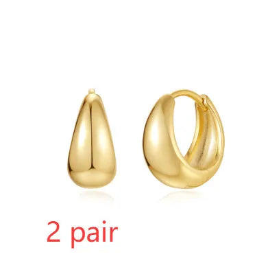 Gold tone brass diamond earclip earrings with geometric round shape and European styling