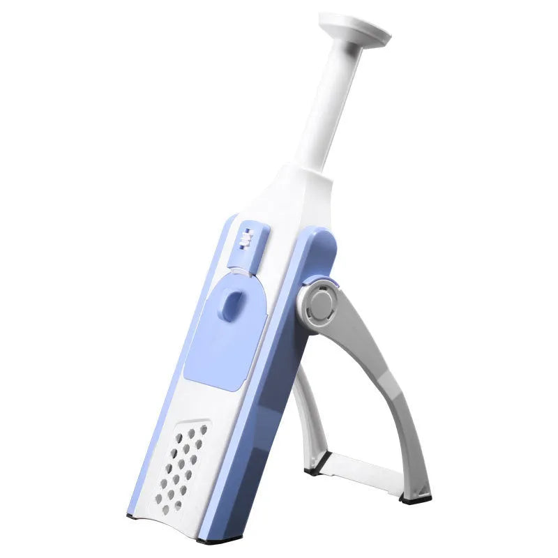 White and blue multifunctional vegetable slicer with stainless steel blades on a kitchen counter