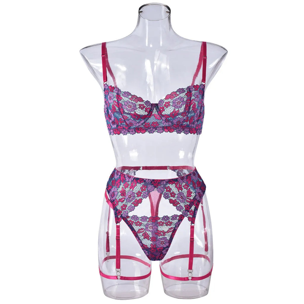 Rose red women's bikini set with floral embroidery on a white background.