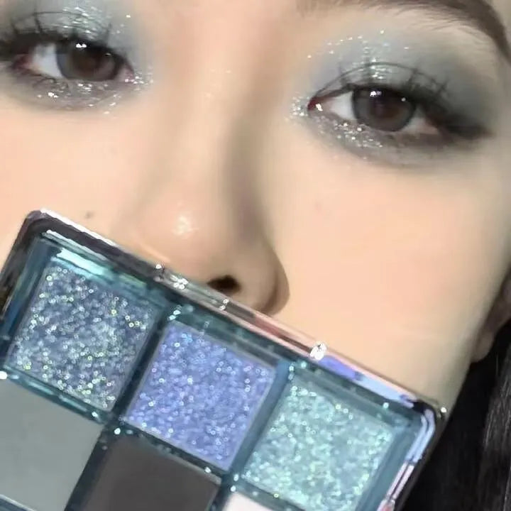 MUGELEEN nine-colour eyeshadow palette showing ice blue smoked shades and earth tone mattes