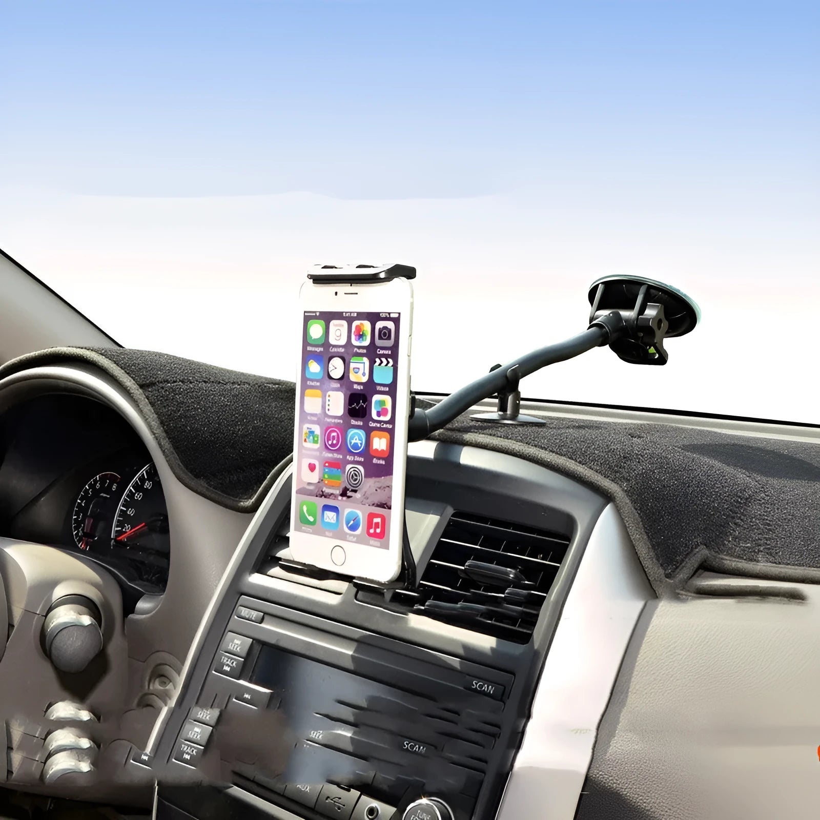 Black universal car tablet holder with suction cup mounted on a dashboard, holding an iPad.