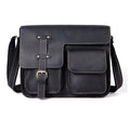 Brown leather vintage messenger bag with brass zipper and adjustable crossbody strap.