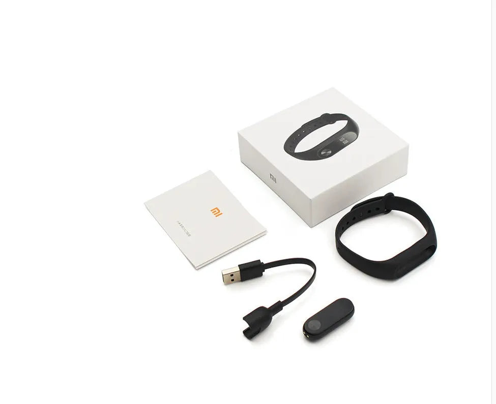 Black Xiaomi Mi Band 2 smart wristband with OLED screen on a textured thermoplastic elastomer strap.