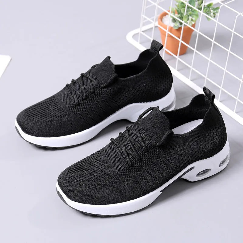 Women's casual lace-up sneaker with mesh upper and solid colour option