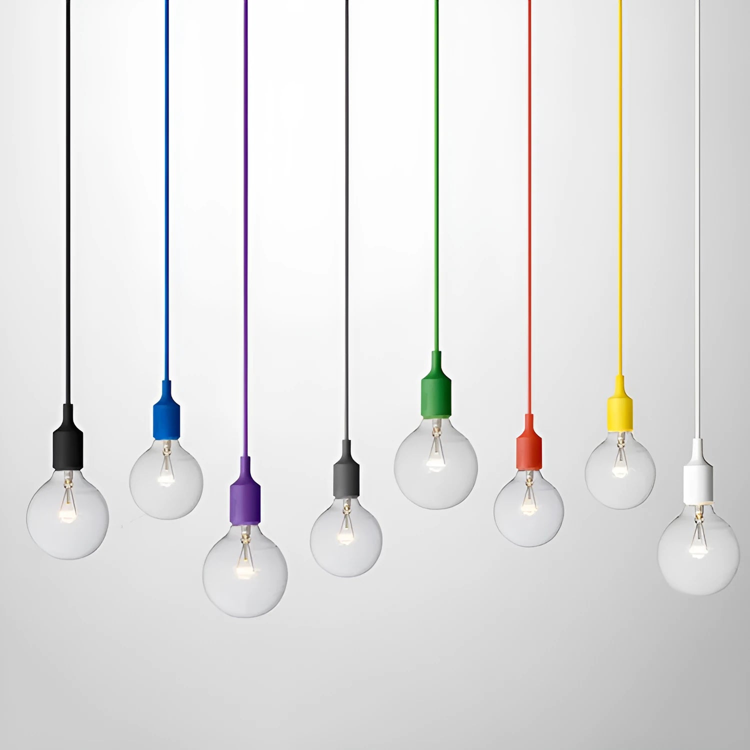 Silicone pendant light holder with black cord and E27 socket next to white and blue colour variants.