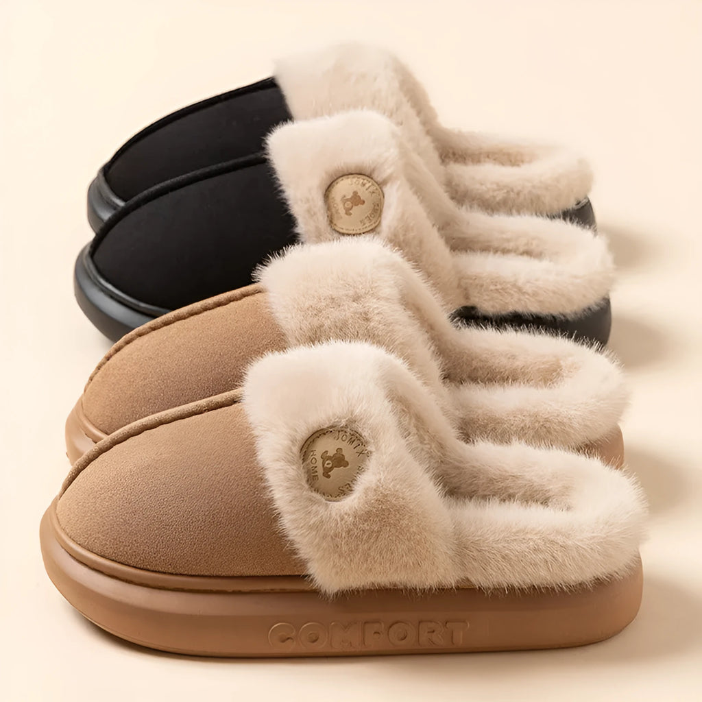 Pair of thick-soled fleece slippers in various colours on a plain background