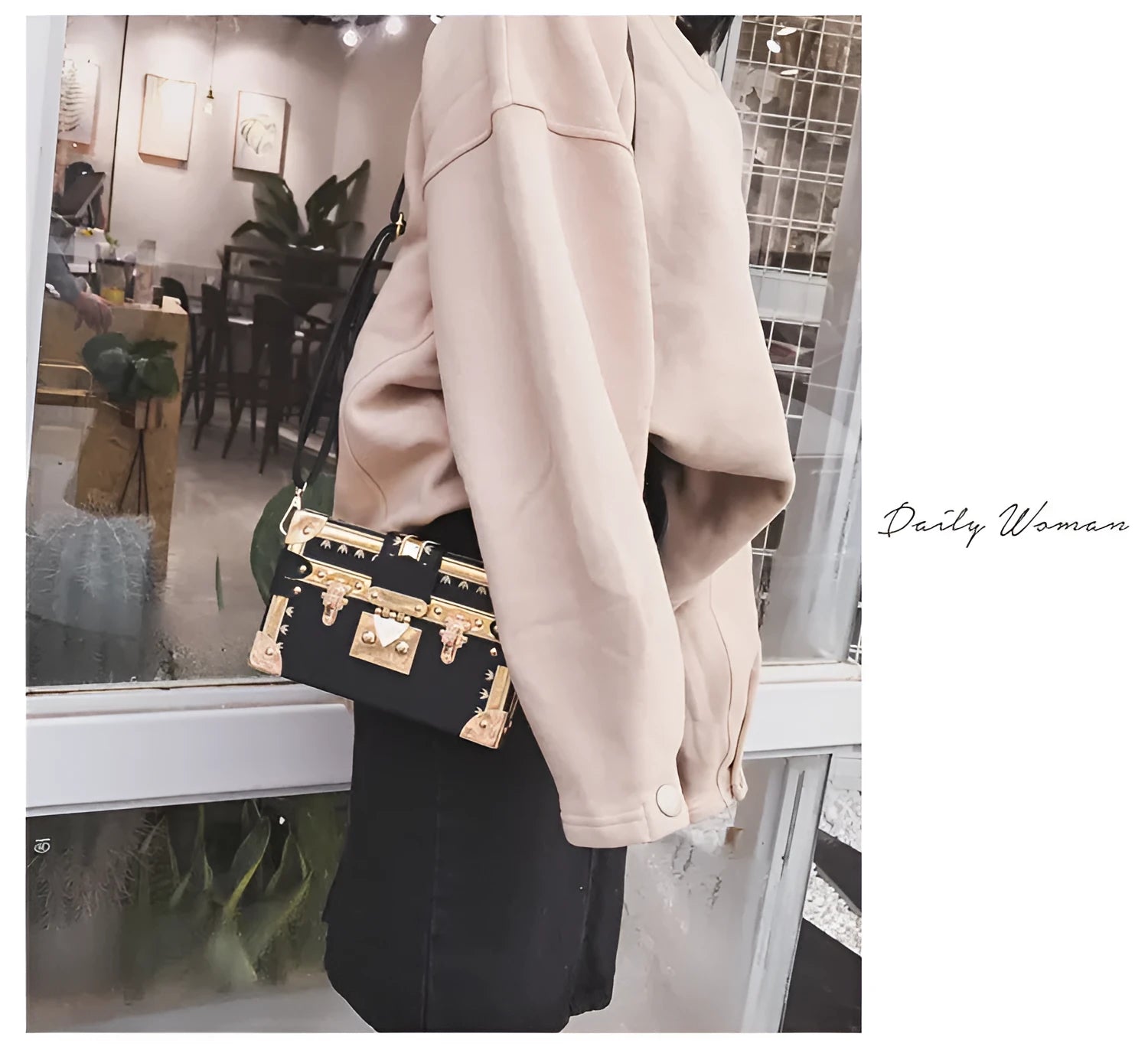 Black hard shell women's shoulder bag with a flap and crossbody strap
