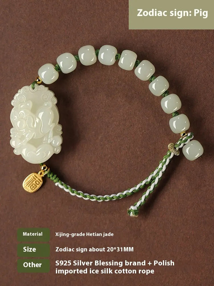 Rabbit Chinese zodiac bracelet with Hetian jade charm and silver card on a red rope.