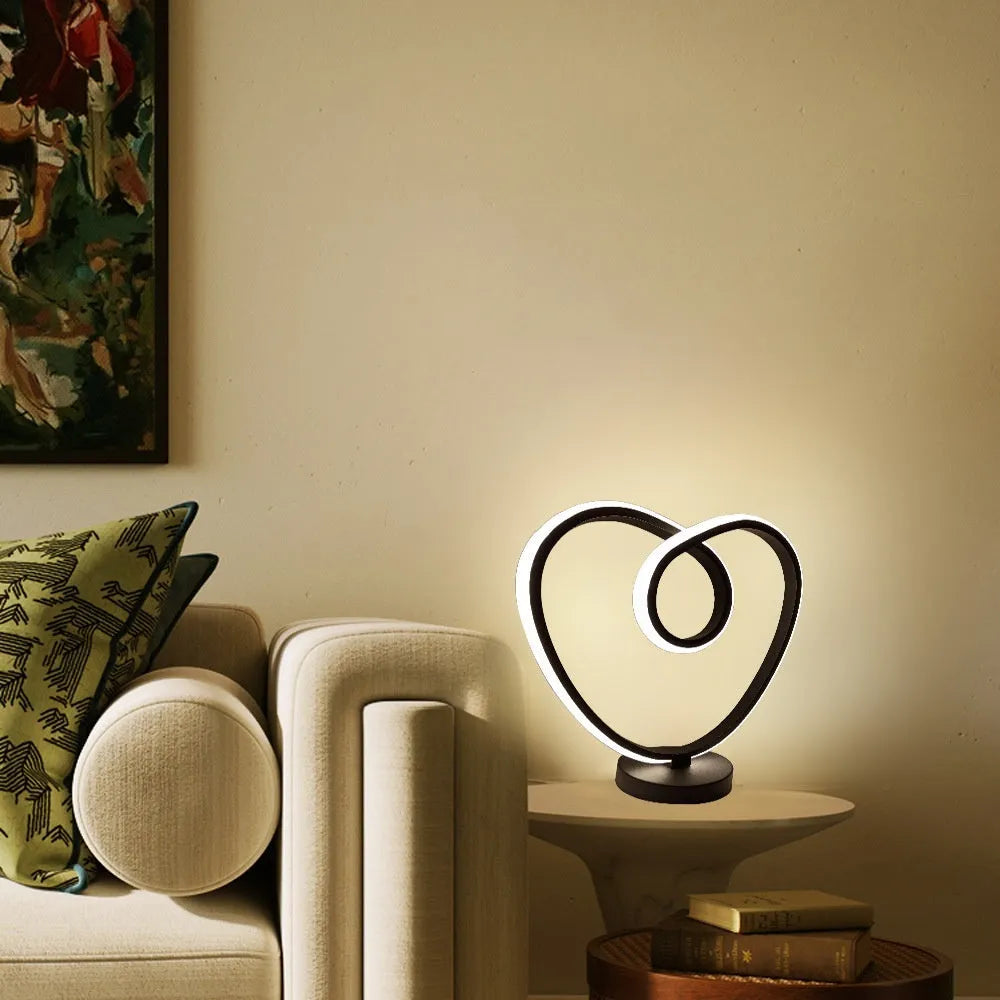 Black musical note shaped Bluetooth LED night light with remote control on a bedside table.