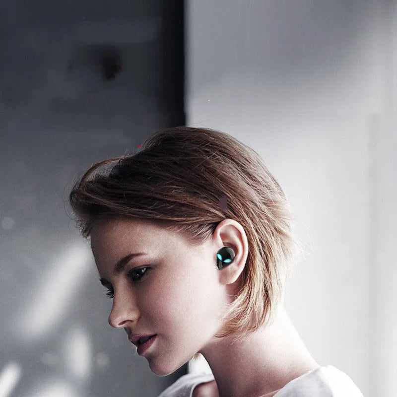 Creative Outer T8 Starman alien design wireless earbuds in red and blue with charging case.