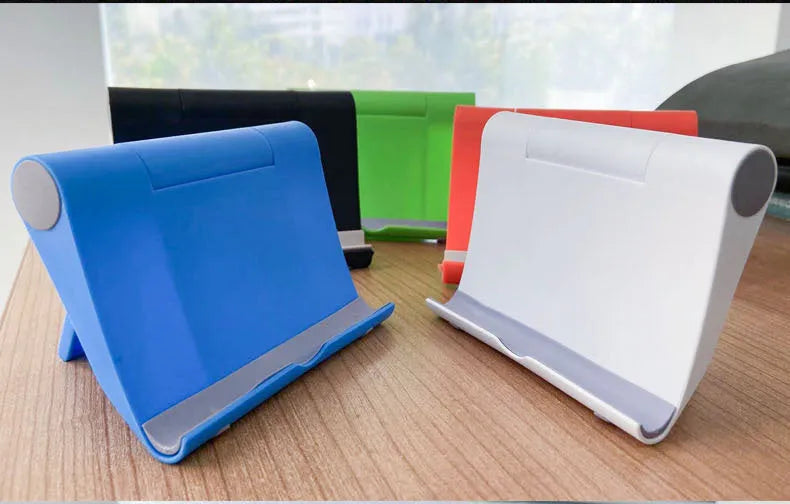 A black PE plastic folding stand holding a mobile phone at an angle.