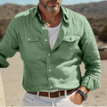 Men's long-sleeved loose-fit shirt in a cotton and linen blend, shown in a solid colour.