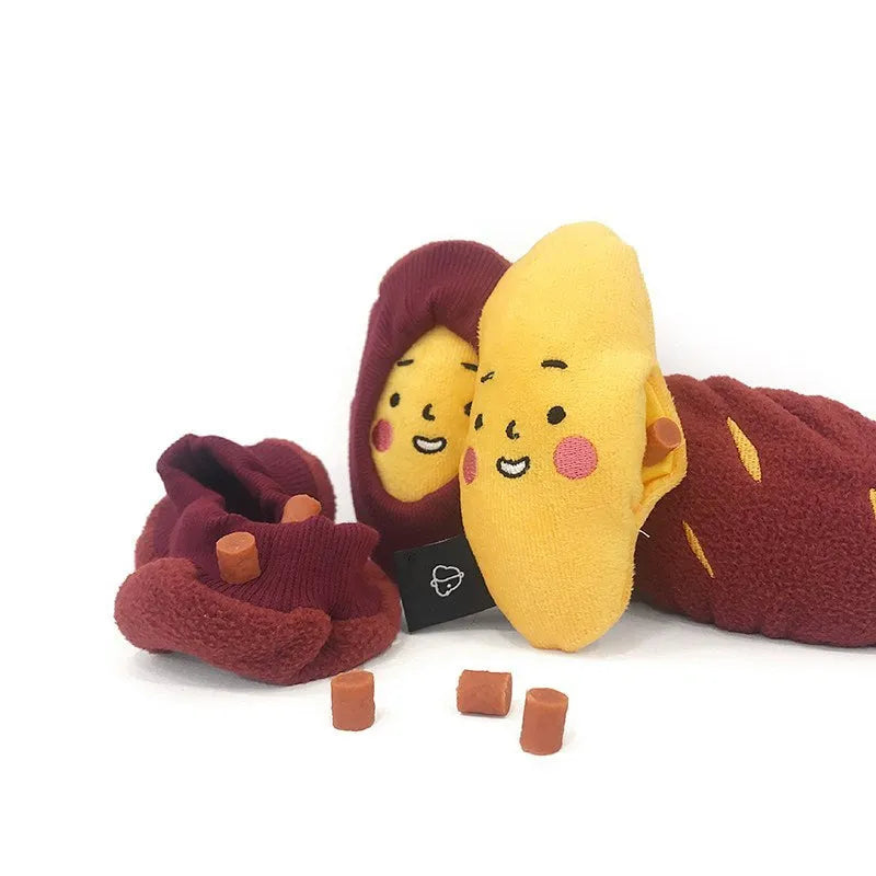 Red silicone sweet potato pet puzzle toy with hidden treat compartments for dogs