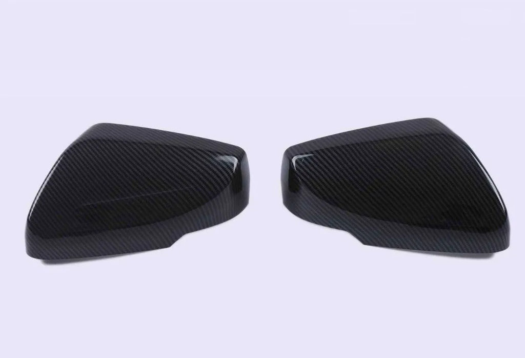 Pair of ABS plastic rearview mirror covers for Cadillac CT5 and CT6 cars in carbon fibre pattern finish.
