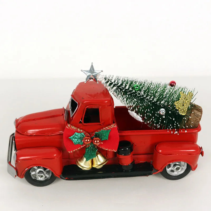 Retro red wrought iron Christmas truck ornament on a white surface, side view showing 17 cm length