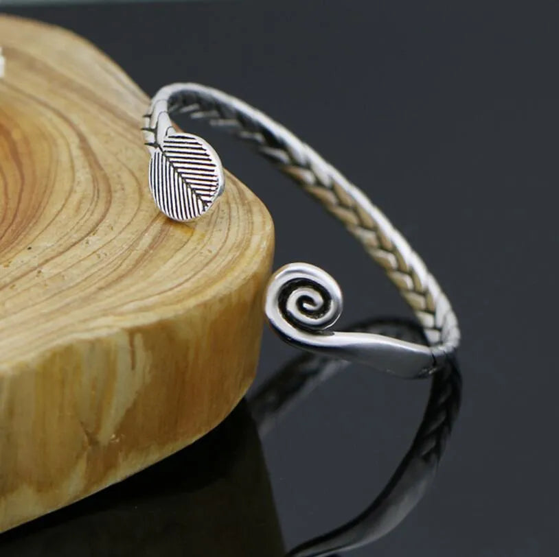 Women's Chinese retro style opening bracelet with fish charms in silver electroplated finish