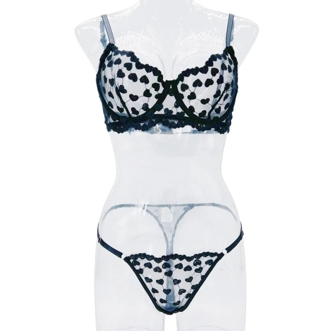 Women's black mesh two-piece suit with romantic multi-colour pattern showing cropped top and matching trousers