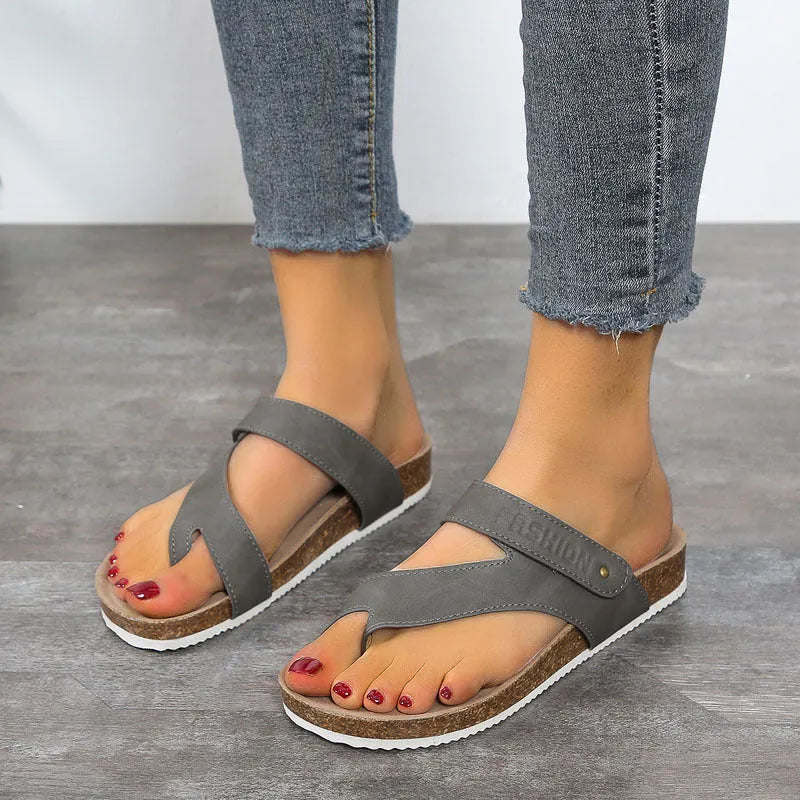 Flat toe ring thick-soled flip-flops in a solid colour on a white background.
