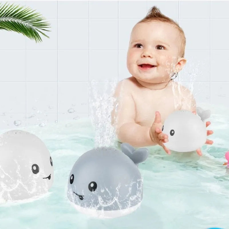 Automatic water spray whale bath toy with LED lights for baby sensory play
