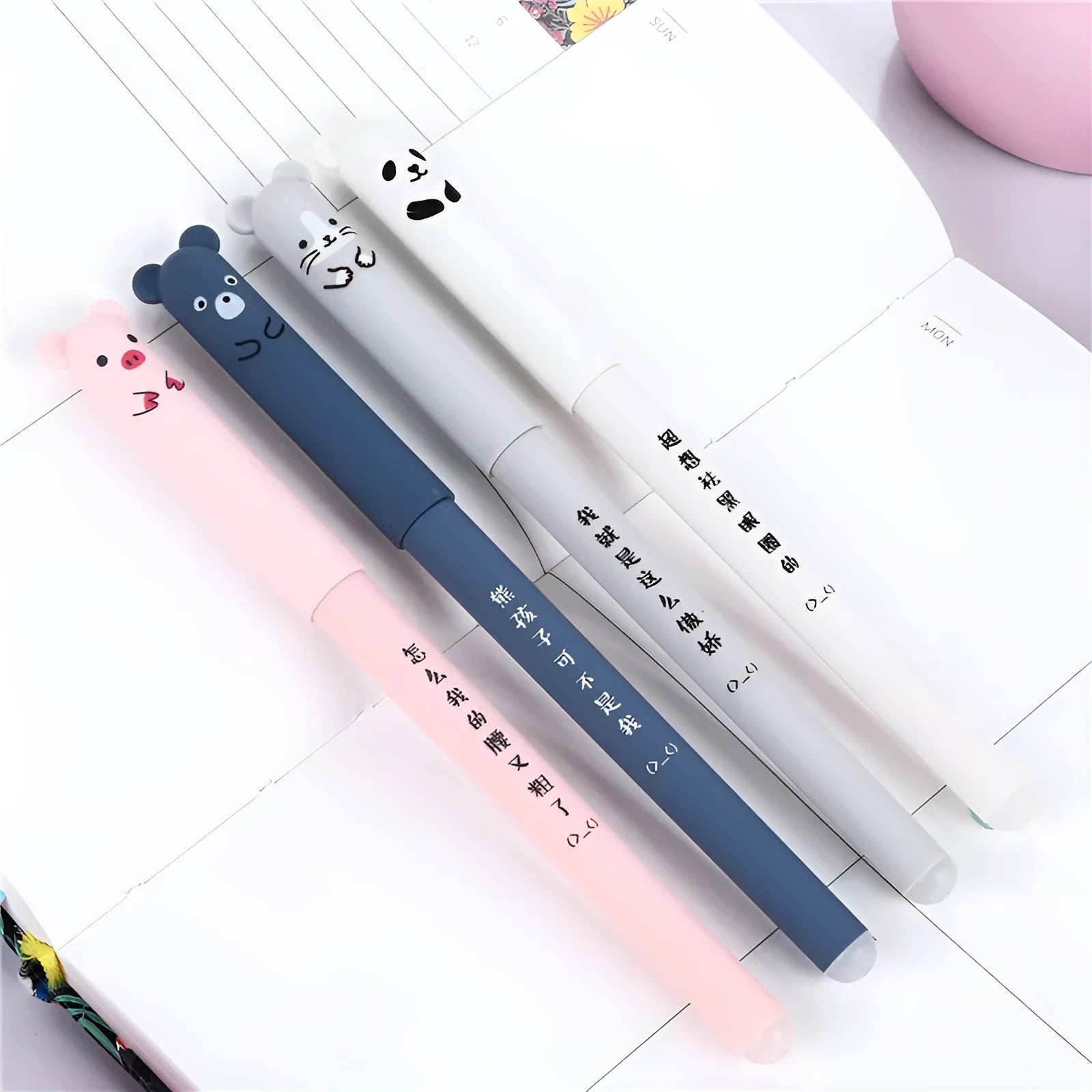 0.5mm fine tip hot erasable pen in black, blue, and red with refill sets on a white background.