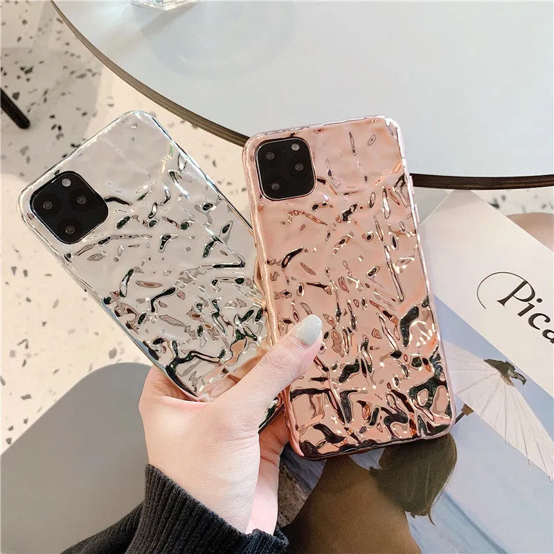Foldable electroplated TPU iPhone case in rose gold and silver colours, shown on an iPhone.