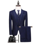 Men's formal suit set in black, single buckle style, jacket and trousers on hanger