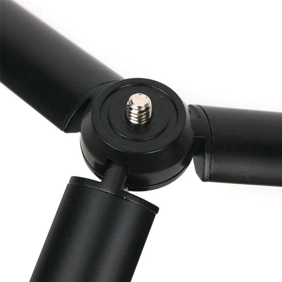 Black aluminium mobile phone tripod and handheld stabiliser accessory compatible with Apple iPhone smartphones