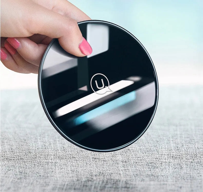 Glass disc wireless charger for smartphones in black or white with charging indicator