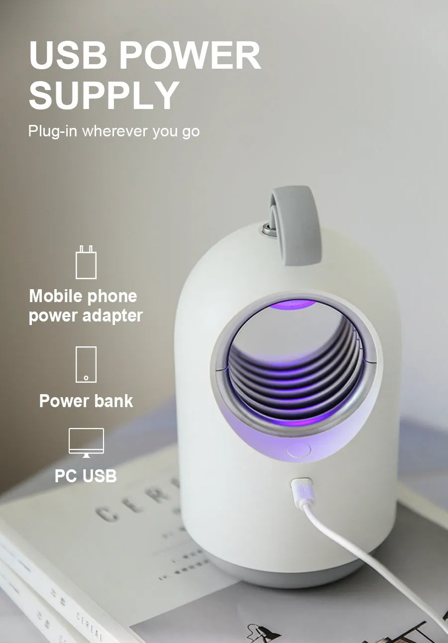 Blue and white portable USB mosquito killer lamp with silicone handle and UV light.