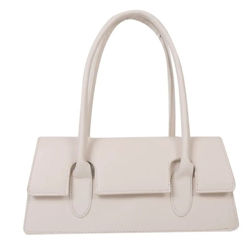 Women's small square shoulder bag in PU leather showing document compartment interior and stitching detail