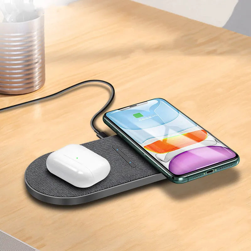 Black dual wireless charging pad with two device charging areas and LED indicator light