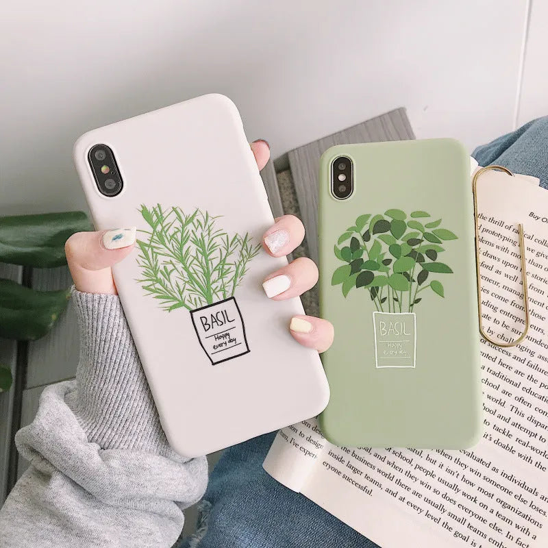 White silicone iPhone case with a detailed green plant pattern on the back, showing full device coverage.