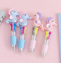 Cute cartoon-themed four-colour press-type ballpoint pen with a silicone grip and 0.7mm tip.