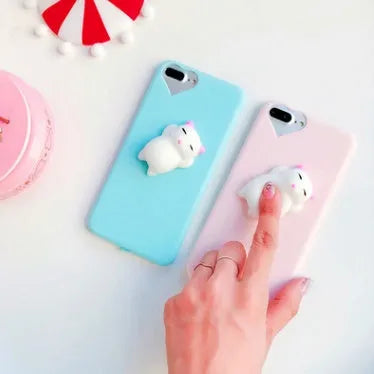 Soft pink TPU silicone iPhone case with a raised 3D cartoon cat design on the back.