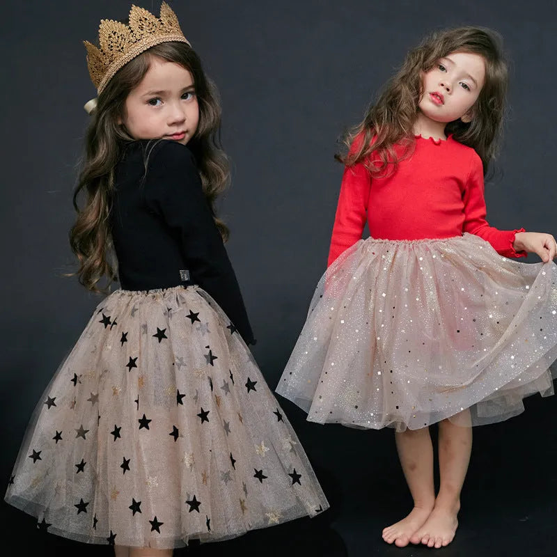 Girls red Christmas dress with long sleeves, princess skirt, and embroidered star details