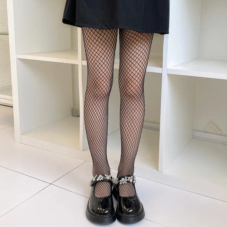 Women's sheer mesh pantyhose showing large, medium and small pattern options in black and white colours