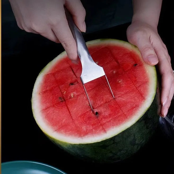 Silver stainless steel watermelon fork slicer with extended handle and rounded fork head