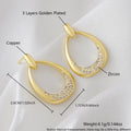 Yellow gold geometric ring drop earrings with electroplated finish on copper, 2.6 x 1.7 cm dimensions
