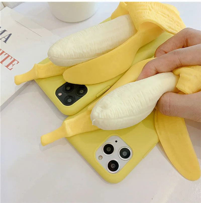 Yellow silicone banana-shaped phone case with unzip detail for iPhone models.