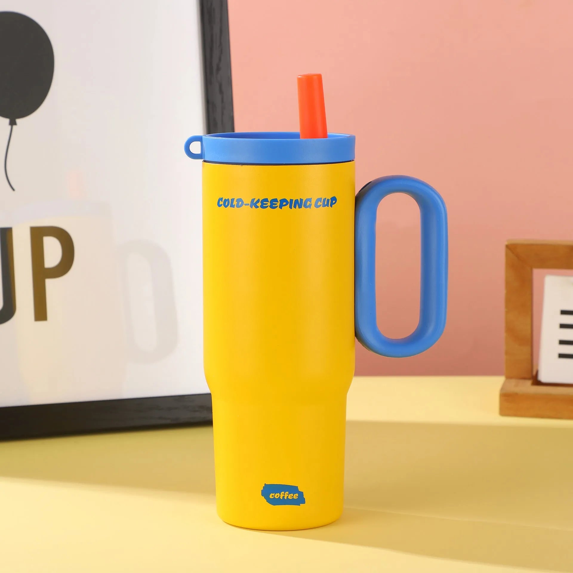 Insulated plastic straw cup with carry handle in five colour options showing 700ml capacity