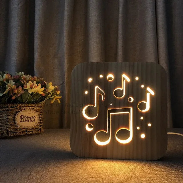 Square pine wood frame USB LED atmosphere lamp emitting warm white light on a desk.