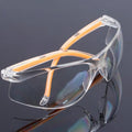 Transparent polycarbonate safety goggles with yellow tint lenses for laboratory and welding work